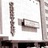 Static pixelated image showing a vertical dark brown bar on the left, a central white area with a dark brown rectangular shape, and a vertical dark brown bar on the right.