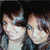 Two pixelated figures with light skin tones and brown hair, wearing white tops against a dark background.