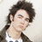 Pixelated portrait of a person with dark tousled hair against light background, green text on blue field reads "Mrs. Paul" and "Kevin Jonas!" with heart symbol.