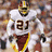 Pixelated image of a football player in white uniform with number 21, split into four quadrants with red and gray sections containing yellow text.
