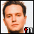 A 2x2 contact sheet of three distinct pixelated headshots with red-and-white "fan" text in the bottom-right corner of each frame, set against a gray background.