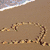 Animated beach scene with palm trees, ocean waves, and a sunset sky transitioning from yellow to orange.