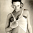 Static 48x48 pixel icon of a person in grayscale tones with visible dithering and low-resolution rendering artifacts, featuring dark hair, light clothing, and a neutral pose against a plain background.