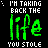 Green and white pixelated text on black background with small green star accents, repeating 'I'M TAKING BACK THE life YOU STOLE' in vertical