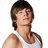 Pixelated image of a person with brown hair in a white tank top on left, next to green background with blue pixel text reading 'he is so CUTE<3 <3' on right.