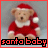 Pixelated Santa baby teddy bear in red outfit with white trim, wearing a red hat and sitting against gray background.