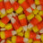 Pixelated orange background with candy corn image and text reading 'My Favorite holiday is coming !!!! :] <8 : ] <8' in black font.