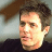 Static 48x48 pixel icon showing a close-up of a person's face with dark hair and light skin, rendered in low-resolution pixel art style against a gradient background.