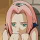 Anime character with pink hair and blue eyes in a static pose, hands clasped under chin, against a brick wall background.