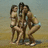 Three people in swimwear pose on a beach with text overlays in cyan pixelated font on black background.