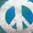 Pixelated blue and teal shapes on a light gray background with darker gray accents.