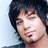 Pixelated portrait of a person with dark hair and a goatee on a light blue background, with text reading "Adam Lambert" and "My American Idol" below.