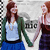 Two pixelated figures holding hands, one in a green cardigan and blue skirt, the other in a white shirt with red hair, against a checkered background.