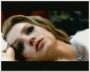 Four distinct frames of a person with long blonde hair in various poses and backgrounds, including close-ups and crowd scenes.