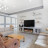 Pixelated static image showing a blurred interior with furniture and windows, no distinct subjects or text visible.