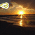 Sunset over water with a bright yellow sun and reflection, featuring a small pixelated white and green icon in the top-left corner.