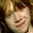 Three distinct facial expressions of a person with light brown hair in a , showing smiling, neutral, and yawning poses