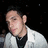 A static image with a blue background, red pixelated text, and a small photo of a person in a white jacket.