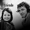 Black-and-white image of two people smiling side-by-side with the word 'friends' above them in stylized text.