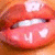 Close-up of lips with glossy red lipstick, showing subtle animation changes in lip shape and light reflection