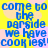 Blue pixelated text on a yellow background with pink cloud shapes, repeating 'come to the parside we have cookies!' in a pattern
