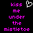 Pixelated text reads 'kiss me under the mistletoe' in bright pink on black background with white heart symbol above.