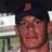 A pixelated image shows a person wearing a dark cap with a red emblem, standing beside a red background with white text reading "Go Red Sox!".