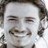 Static 48x48 pixel icon with low-resolution grayscale facial features and indistinct background elements.