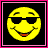 Yellow pixelated smiley face wearing black sunglasses with a red mouth, set against a black background inside a pink border.