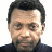 Pixelated image of a person with short dark hair and light skin wearing a dark high-collared shirt, alongside blue text reading "Lady's Man" on black background and "Original Icons .com" in stylized font.