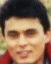A person with dark hair and a red collar appears in showing animation changes to the face, including sunglasses and pixelated effects