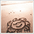 A split- image shows a brown floral design on the left and blue text on a beige background reading "JAMAICA W/ TAYLOR MARCH 23!!!" on the right