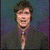 A split-screen image shows two distinct portraits of a person with brown hair, one in dark clothing against a blue background and the other in light clothing against purple, with red text reading "JEFF DAVIS" below.
