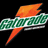 Pixelated icon with green and white checkered pattern, orange flame-like shape above, and orange tail below on black background.