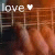 Animated contact sheet showing two frames of a buddy icon with 'love' text and heart symbol over blurred background.
