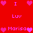 Red background with pink pixelated hearts and text reading "I Luv Marisa" arranged in a pattern