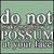 Pixelated text on a green background reads 'do not POSSUM at your face' with visible pixelation and grayscale lettering.