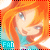 Pixelated icon of a person with long orange hair wearing a teal top, smiling slightly while looking left, with 'FAN' text in blue at bottom-left.