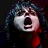 Pixelated image of a person with dark hair and red accents on the left, next to white pixelated text reading "drenched in my pain again" on a black background.