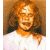 A 50x50 pixel animated contact sheet showing two frames of a buddy icon with a woman's face on the left and green text reading "Original Icons .com" on the right against a dark background.