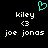 A pixelated image with a cyan heart symbol above two identical text blocks containing 'kiley', '<3', and 'joe jonas' on black background.