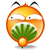 Pixelated orange circular character with white eyes, black pupils, and two antennae; mouth open to reveal green fan-shaped object and small round fruit-like item.