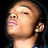 Static 48x48 pixel buddy icon showing a close-up of a person's face with dark hair, light skin tone, and closed eyes against black background.