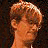 A pixelated animated sequence shows a person with light brown hair turning from left to right, followed by the text "BADASS" in bold white letters on black background.