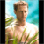 Pixelated static image of a shirtless person with light brown hair against a beach background featuring blue sky and green foliage.