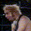 Two side-by-side pixelated images of a person with light-colored hair, one showing profile view and the other front-facing.