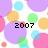 Pixelated image with colorful circles on white background and black text reading '2007' in center.