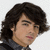 A pixelated image of a person with dark wavy hair in three sequential poses showing head movement and text overlay.