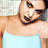 Static 48x48 pixel buddy icon showing a close-up of a person's upper body in a light blue tank top against a blurred background, with visible pixelation and dithering effects.