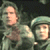 Static 50x50 pixel icon showing two cartoon characters in military-style uniforms with helmets, one holding a weapon, against dark background.